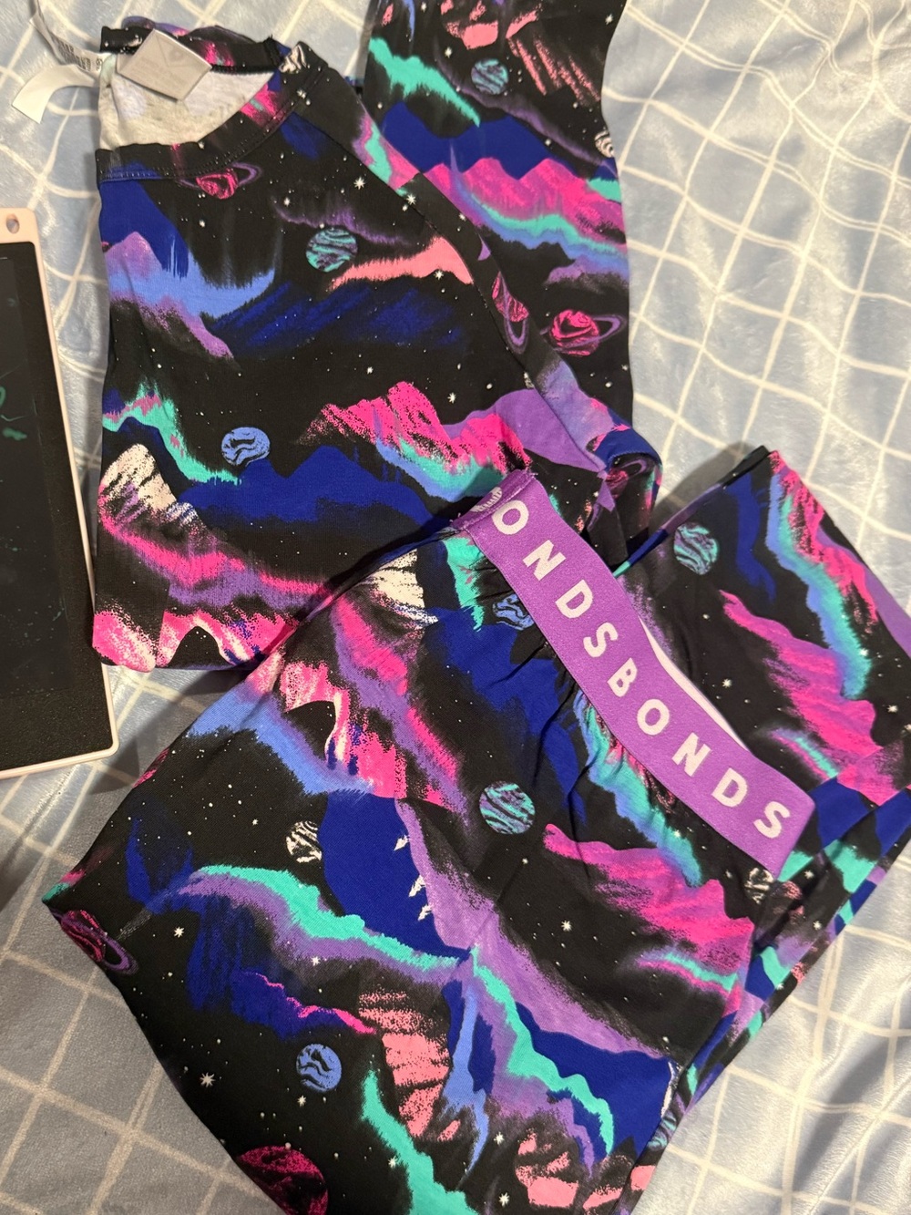 Bonds Kids One-Piece in Black with Neon Purple, Pink & Teal Galaxy Print